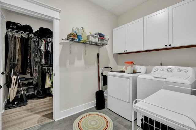852 Pine Grove Rd, Ringgold, GA 30736 - laundry room with cabinet space, independent washer and dryer, wood finished floors, and baseboards