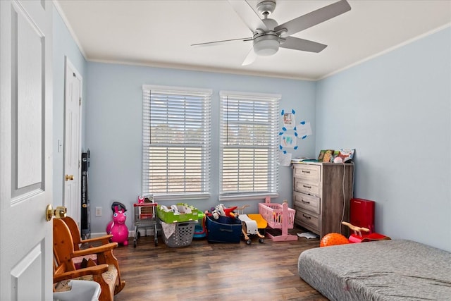 bedroom with ceiling fan, crown molding, and dark hardwood / wood-style floors