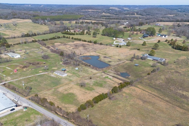 aerial view featuring a rural view and a water view