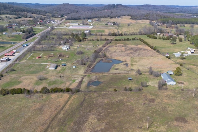 aerial view featuring a rural view and a water view