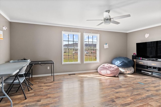 office with crown molding, ceiling fan, and wood-type flooring