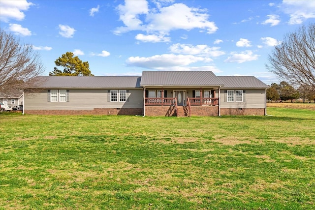 ranch-style home featuring a front yard