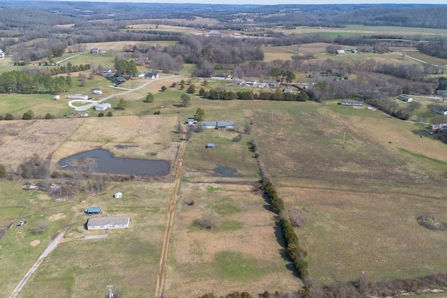 birds eye view of property with a rural view and a water view