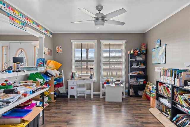 playroom featuring ceiling fan, dark hardwood / wood-style flooring, and ornamental molding