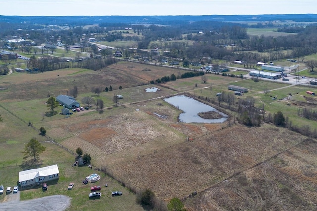 aerial view featuring a rural view and a water view