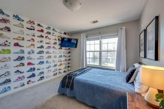 carpeted bedroom with visible vents