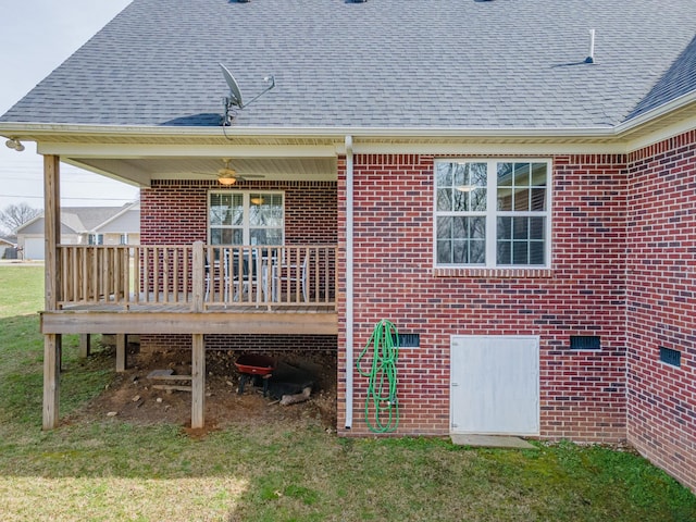 exterior space with a lawn and a wooden deck