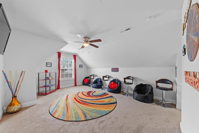 game room featuring ceiling fan, vaulted ceiling, and light carpet