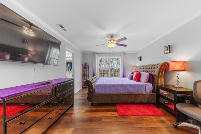 bedroom with ceiling fan, crown molding, and dark hardwood / wood-style floors