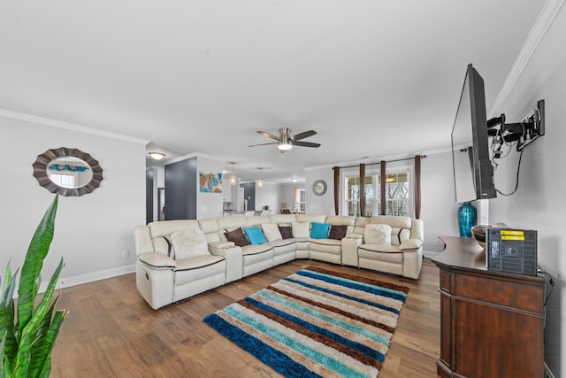 living room featuring ceiling fan, dark hardwood / wood-style flooring, and ornamental molding