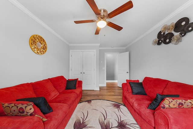 living room with ornamental molding, ceiling fan, and wood-type flooring