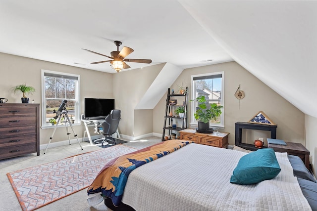 bedroom featuring light carpet, vaulted ceiling, and ceiling fan