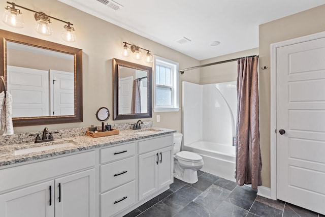 full bathroom with toilet, vanity, and shower / tub combo