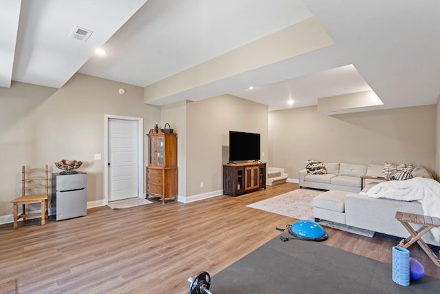 workout room with hardwood / wood-style flooring