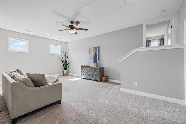 sitting room with baseboards, visible vents, carpet, and attic access