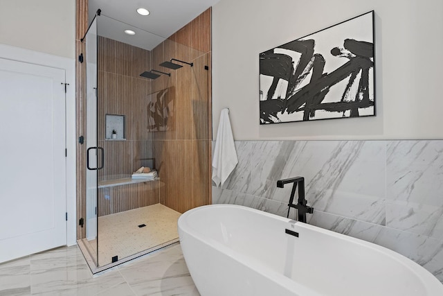 304 35th Ave N, Nashville, TN 37209 - full bath featuring recessed lighting, marble finish floor, a freestanding bath, tile walls, and a stall shower