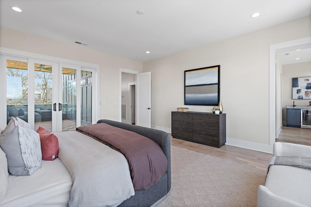 304 35th Ave N, Nashville, TN 37209 - bedroom featuring access to outside, baseboards, french doors, recessed lighting, and light wood-style floors