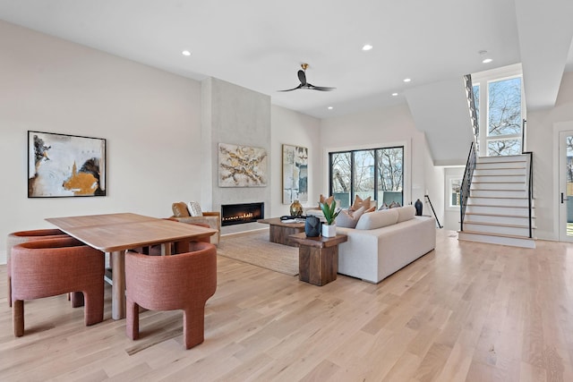 304 35th Ave N, Nashville, TN 37209 - living room with light wood-style floors, a fireplace, recessed lighting, and stairway