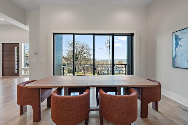 304 35th Ave N, Nashville, TN 37209 - dining space featuring baseboards, a healthy amount of sunlight, and light wood-type flooring