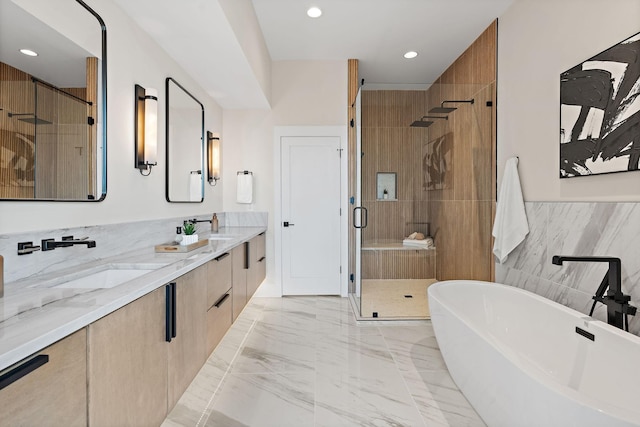 304 35th Ave N, Nashville, TN 37209 - bathroom with marble finish floor, double vanity, a stall shower, a freestanding bath, and a sink