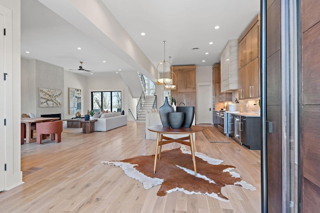304 35th Ave N, Nashville, TN 37209 - foyer featuring recessed lighting, light wood-style flooring, a fireplace, ceiling fan, and stairs