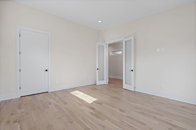 304 35th Ave N, Nashville, TN 37209 - unfurnished bedroom featuring baseboards, light wood-style floors, recessed lighting, and french doors