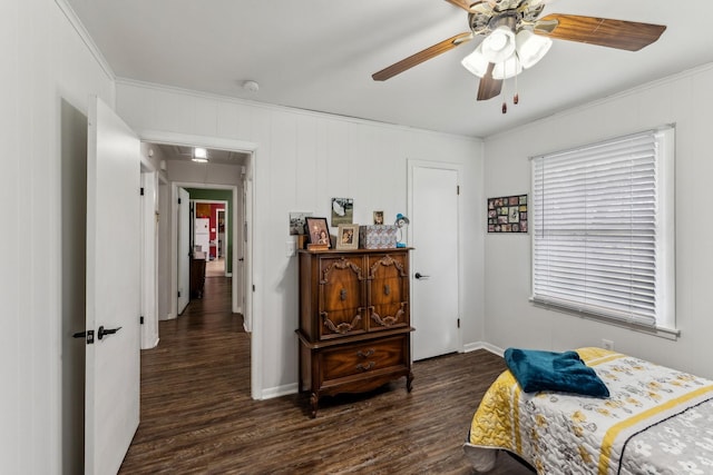 bedroom featuring ceiling fan, crown molding, dark wood-style floors, and attic access