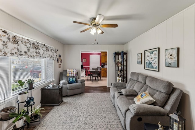 living room with a ceiling fan and wood finished floors