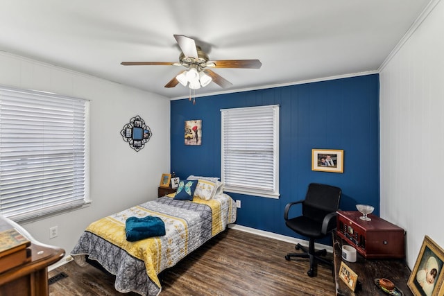 bedroom with dark wood finished floors, baseboards, ceiling fan, and ornamental molding