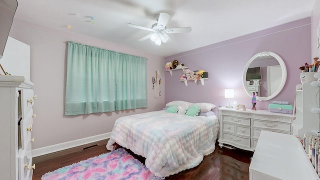 bedroom with baseboards, visible vents, dark wood-type flooring, and ceiling fan