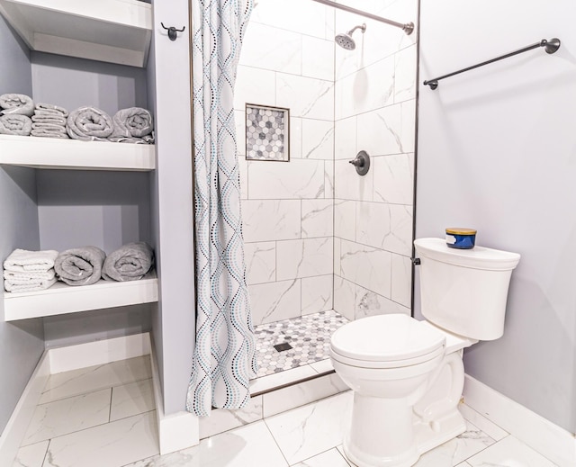 bathroom with baseboards, marble finish floor, toilet, and a shower stall