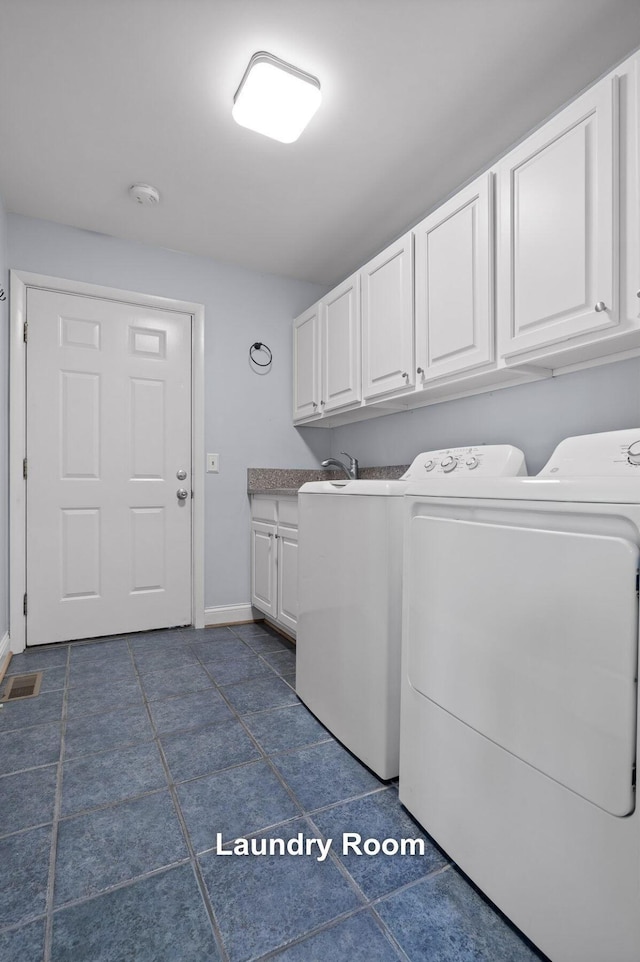 laundry area featuring cabinet space, visible vents, baseboards, washer and dryer, and a sink