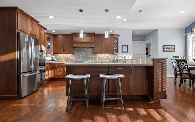 kitchen with decorative backsplash, glass insert cabinets, appliances with stainless steel finishes, decorative light fixtures, and open shelves