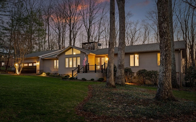 view of front of property with a garage and a front yard