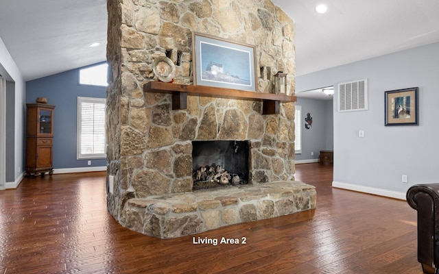 living room with vaulted ceiling, visible vents, baseboards, dark wood-type flooring, and a fireplace