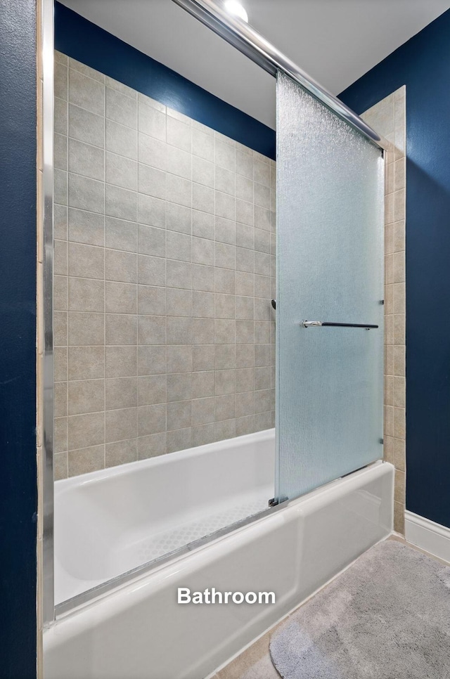 full bath with shower / bath combination with glass door