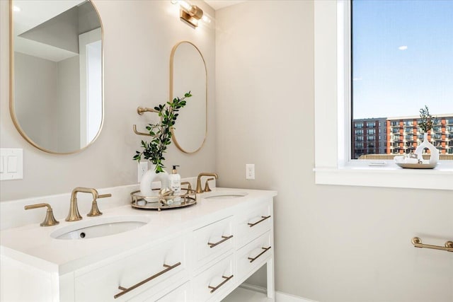 bathroom with double vanity and a sink