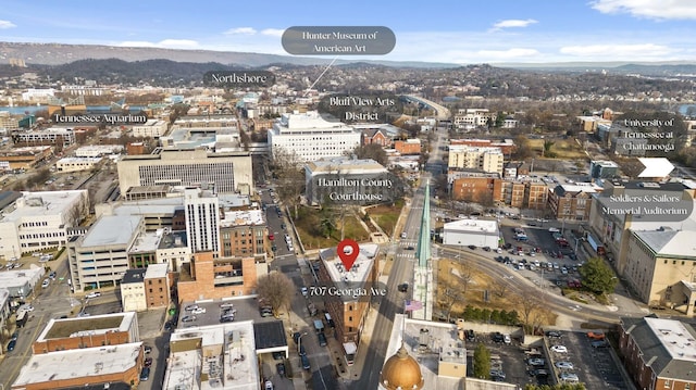 drone / aerial view featuring a view of city and a mountain view