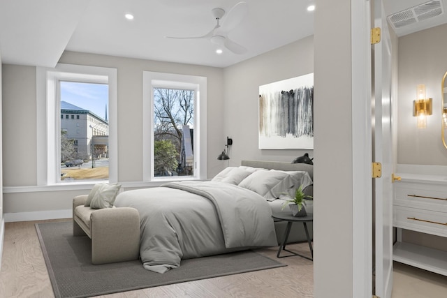 bedroom featuring visible vents, baseboards, a ceiling fan, light wood-style flooring, and recessed lighting