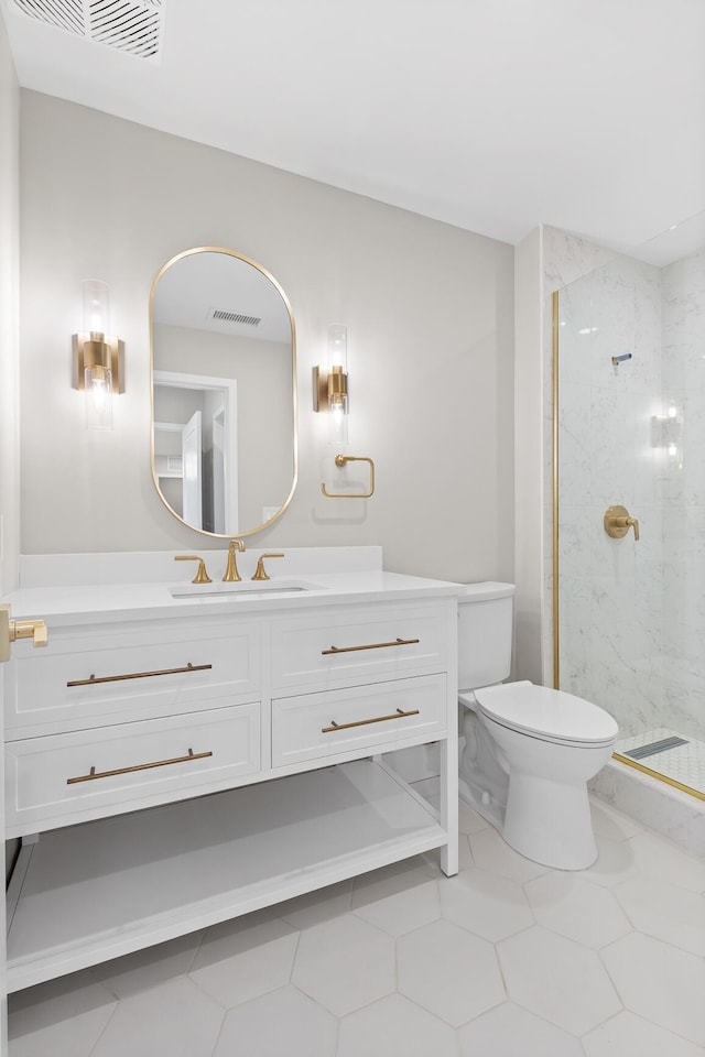 bathroom featuring toilet, vanity, a marble finish shower, and visible vents