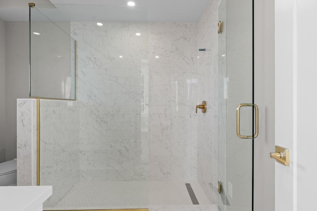 full bathroom featuring recessed lighting, toilet, and a shower stall