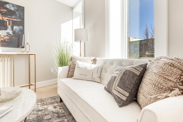 living area featuring baseboards