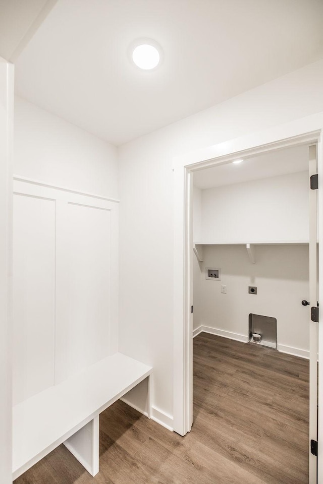 mudroom featuring baseboards and wood finished floors