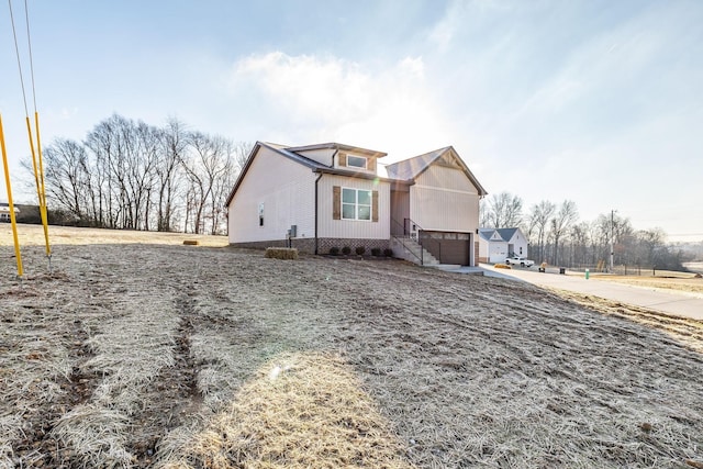 view of front of house featuring an attached garage and concrete driveway