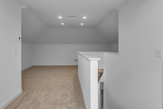 bonus room with recessed lighting, visible vents, vaulted ceiling, and light colored carpet