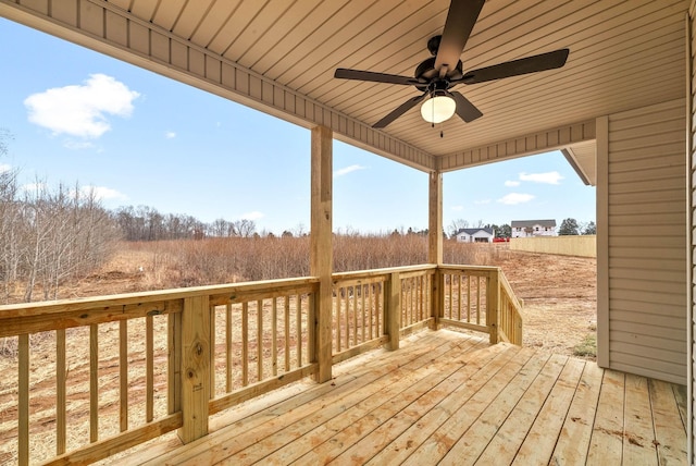 wooden deck with a ceiling fan