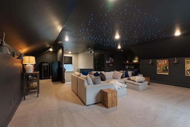 home theater with vaulted ceiling, carpet, and baseboards