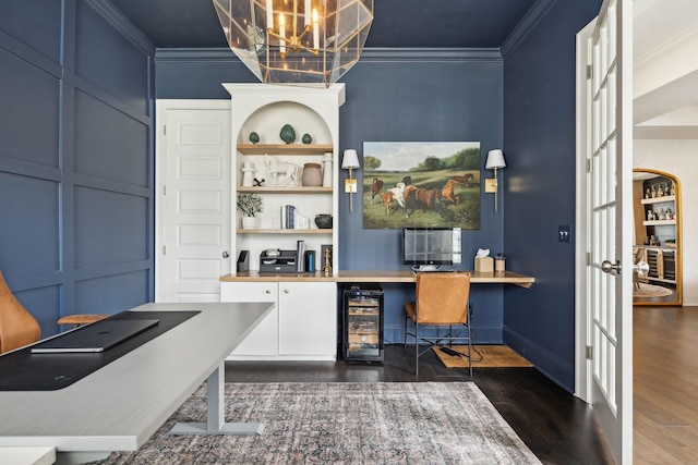 home office featuring baseboards, dark wood-style floors, wine cooler, ornamental molding, and built in desk