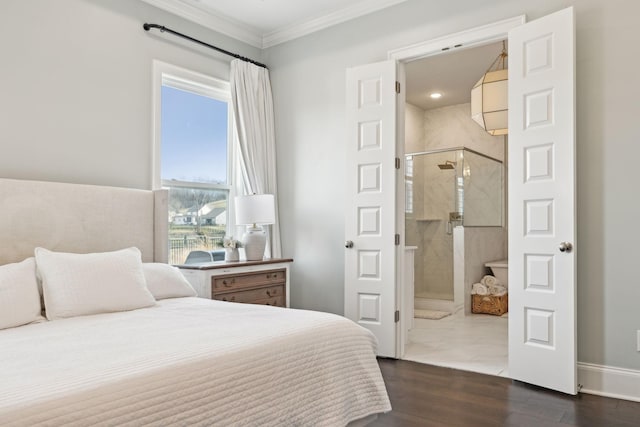 bedroom featuring baseboards, ornamental molding, dark wood-type flooring, and ensuite bathroom