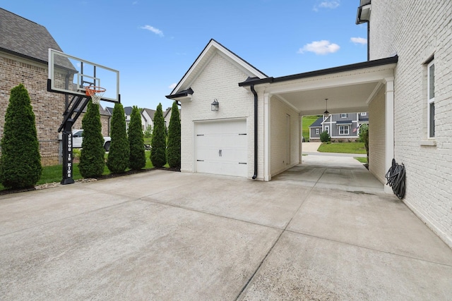 7020 Vineyard Valley Dr, College Grove, TN 37046 - view of property exterior with brick siding, a garage, and concrete driveway